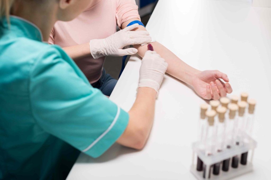 Person getting blood test to detect early health issues