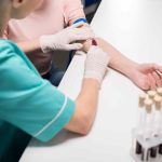 Person getting blood test to detect early health issues